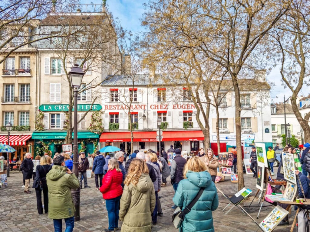 View of the crowd wandering around the neighborhood of Montmartre
