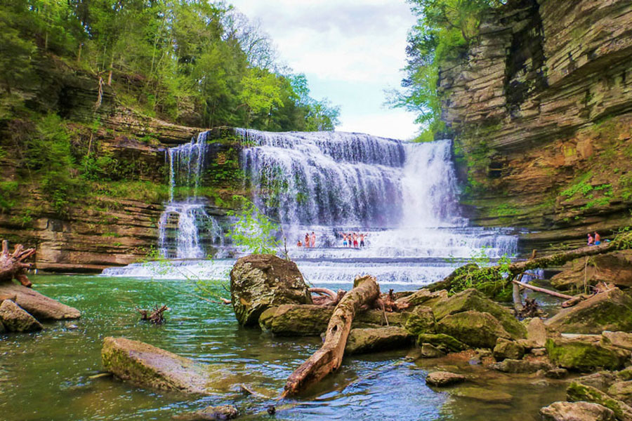 People enjoying their swim in Cummins Falls