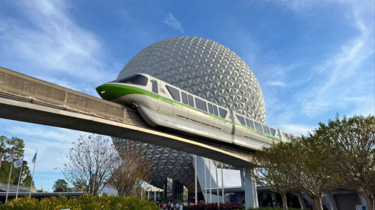 A Disney monorail glides along in front of Spaceship Earth at EPCOT