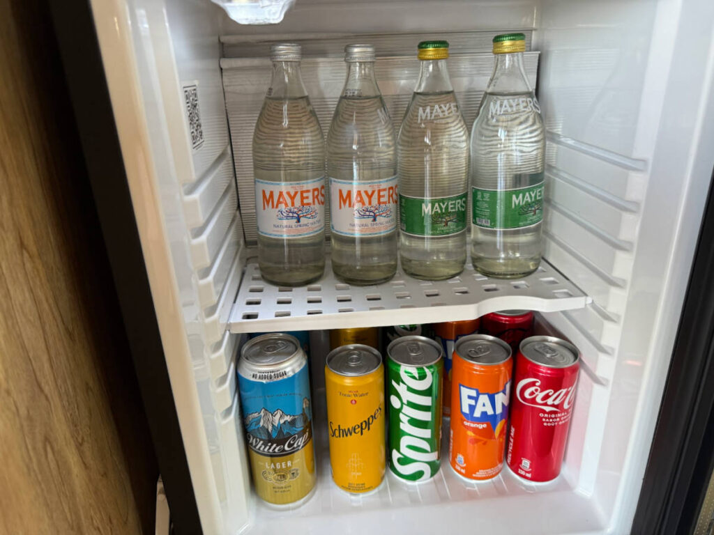 View of the variety of drinks inside the mini fridge
