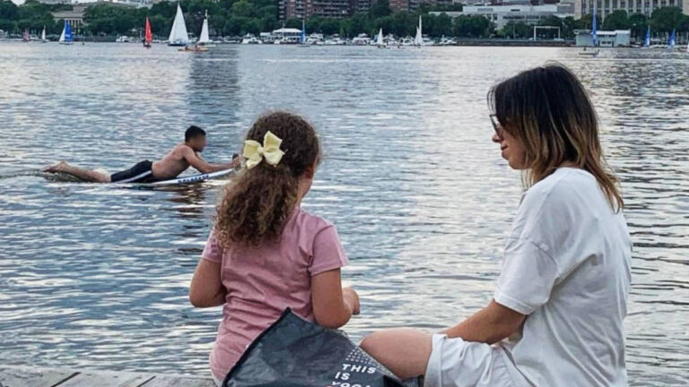 The author Claudicet Pena with her daughter enjoying their day by the Charles River