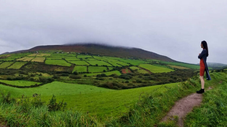The author Niamh Hayes overlooking the panoramic view of Dingle Countryside