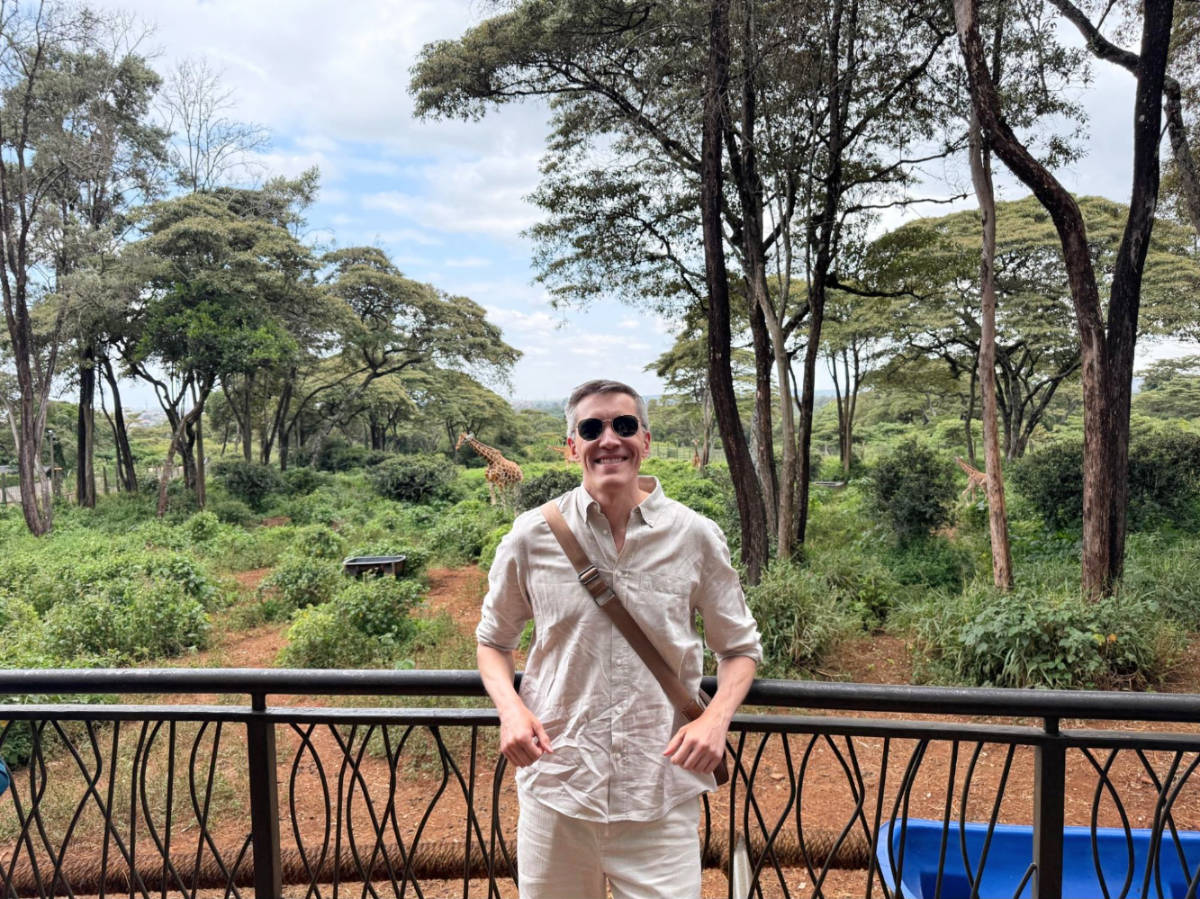 The author Nate Hake posing for a photo at the Giraffe Centre in Karen