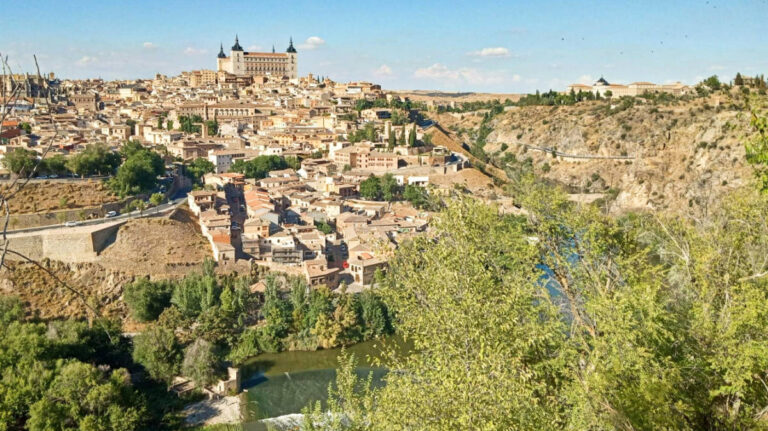 Aerial view of the buildings of Toledo surrounded by greenery