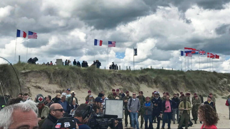A group of tourists visiting at the D-Day Beaches