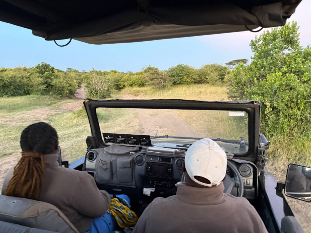 The guide and the spotter sitting on the front seat of the vehicle