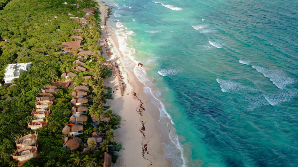 Aerial view of cabanas on Tulum beach (Papaya Playa Project)