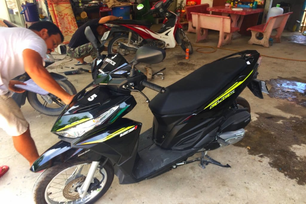 A scooter being inspected