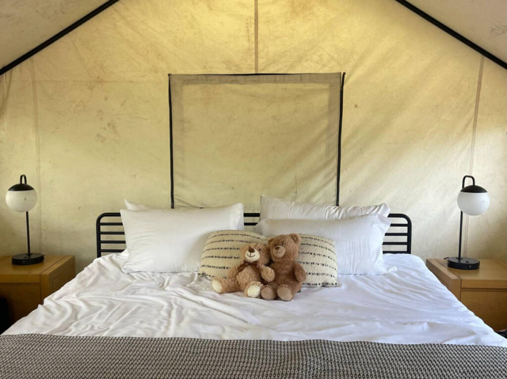 A huge bed with teddy bears inside the Adventure Tent at AutoCamp, Cape Cod