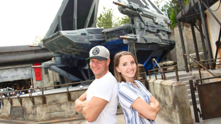 The author Katie Neufeld and her partner posing for a photo at the Disney World