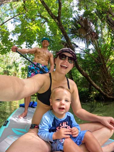 Katie Neufeld paddleboarding with her husband and son in Rock Springs Run