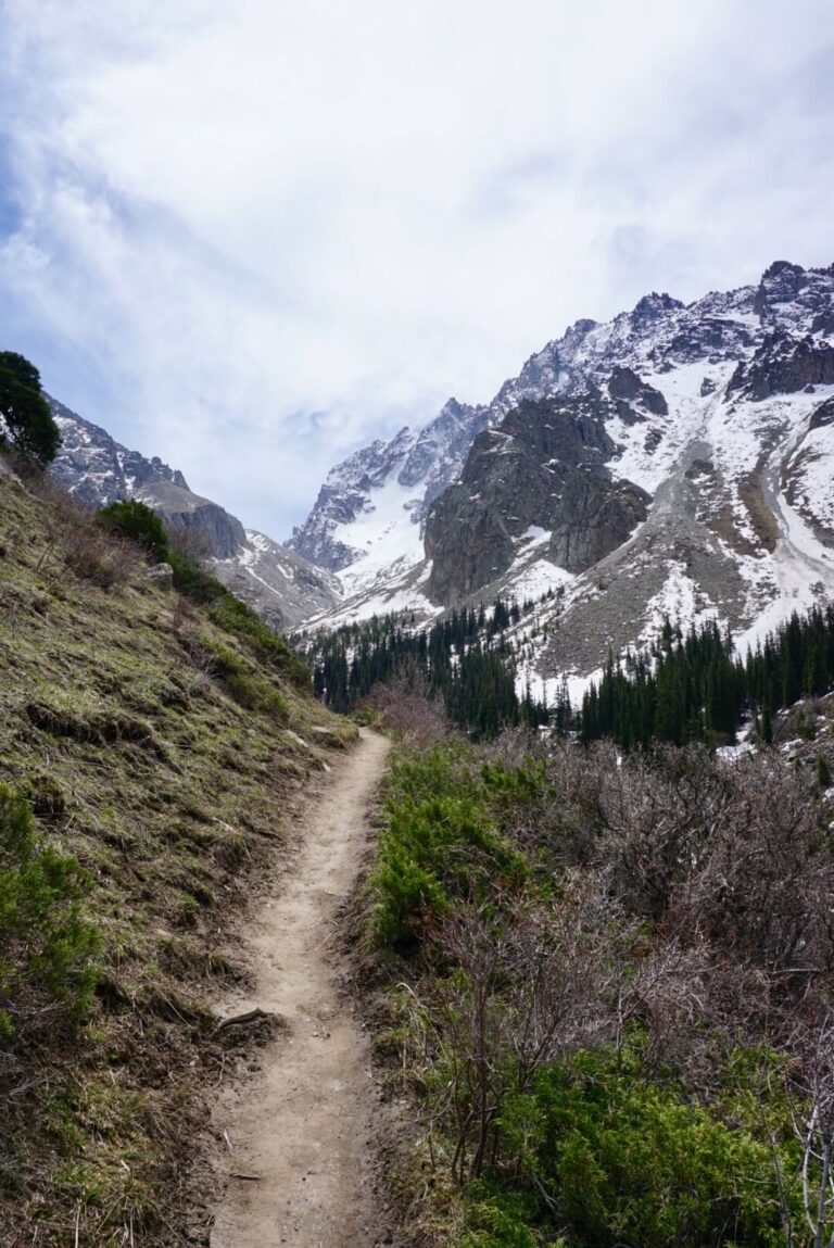 The hiking trail surrounded by mountain ranges in Kyrgyzstan
