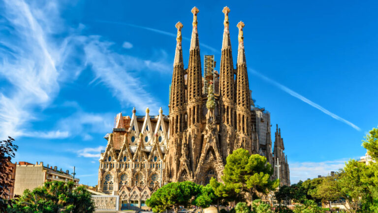 View of the intricate exterior of the La Sagrada Familia on a sunny day