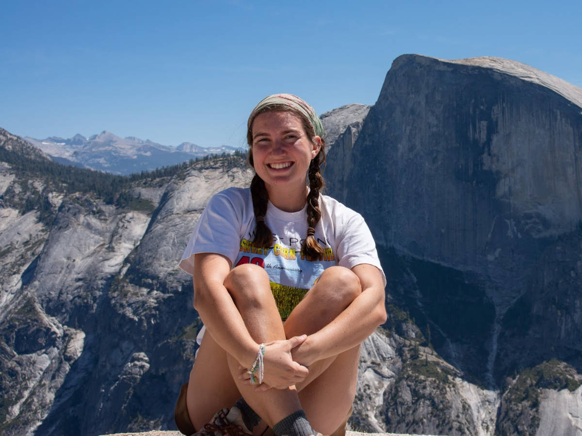 Laura McFarland with a view of a mountain on her background