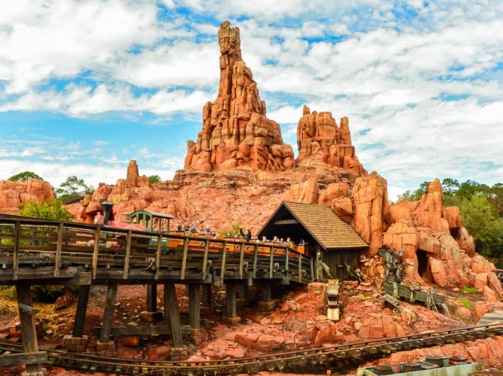 View of the tourists riding on the Big Thunder Mountain Railroad at the Magic Kingdom