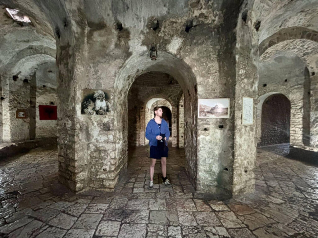 A man exploring inside the Porto Palermo Castle