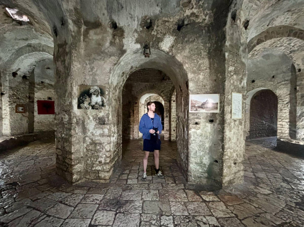 A man exploring inside the Porto Palermo Castle