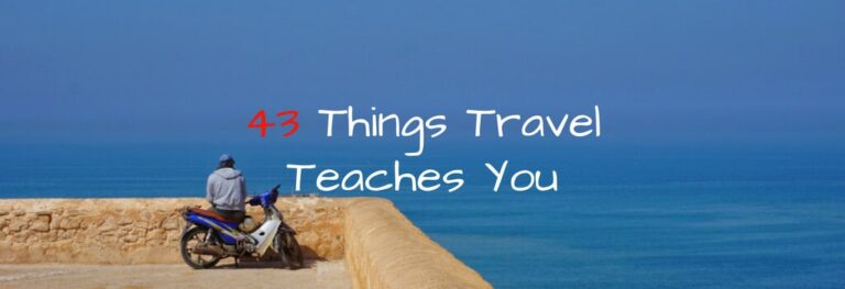 A man sitting in a motorcycle overlooking the ocean