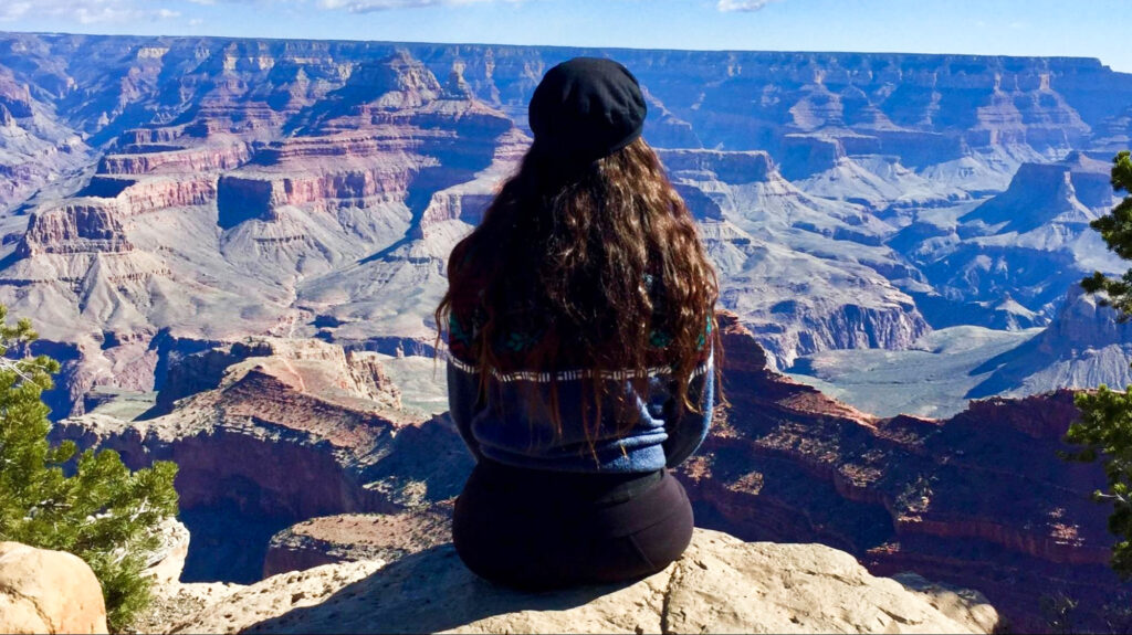 Travel Lemming Writer, McKenna, overlooking the scenic view of Grand Canyon National Park