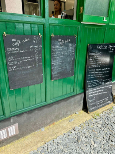 View of menus on a chalkboard in Café Pier Chelsea