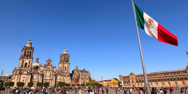 View of Mexican flag at the crowded city center
