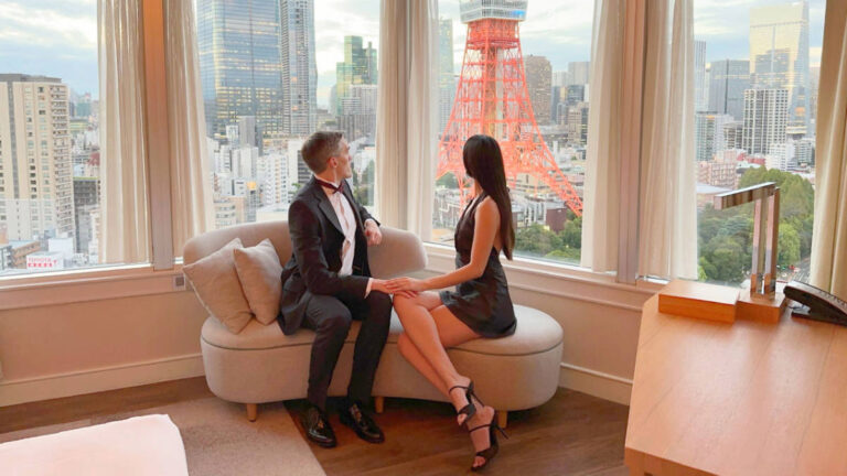 The author Nate Hake with her partner Clara Kesseler admiring the view at Prince Park Tower Tokyo Hotel