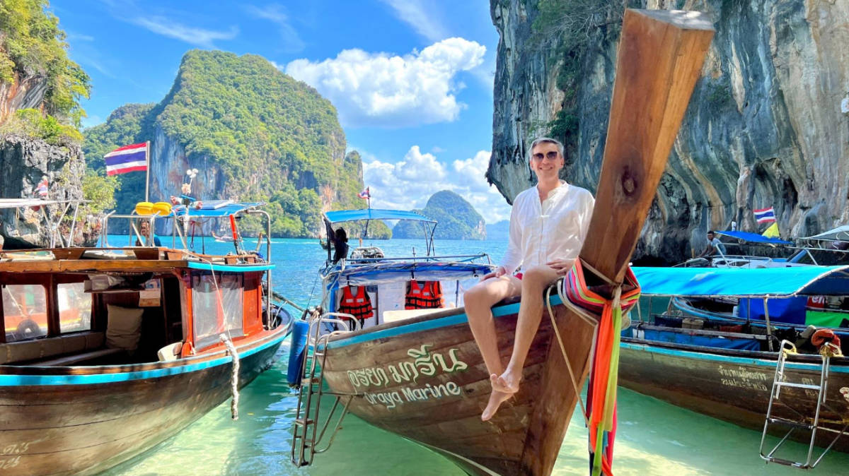 The author, Nate Hake on a long boat in Thailand