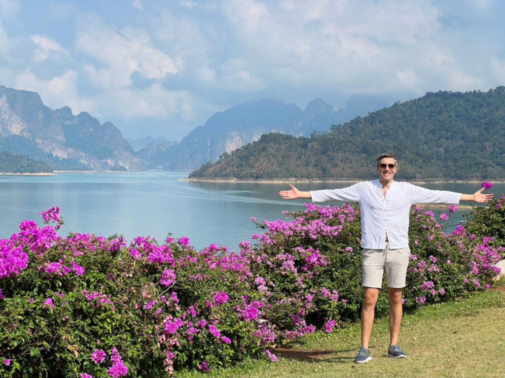 The author, Nate Hake posing for a photo with islands on his background in Thailand