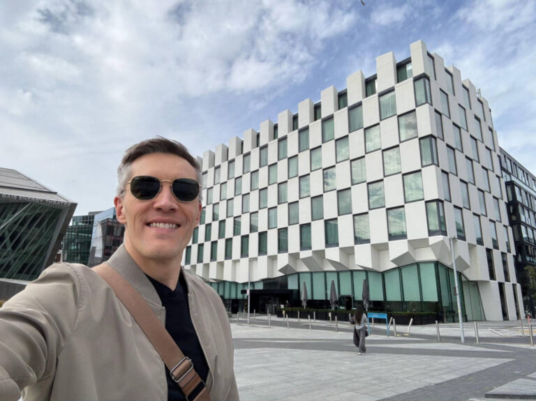 Travel Lemming Founder, Nate Hake, smiling for a photo outside the Anantara The Marker Hotel in Dublin