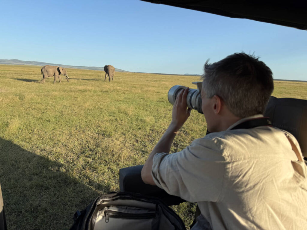 Travel Lemming founder Nate Hake, taking photos of the elephants with the Canon camera