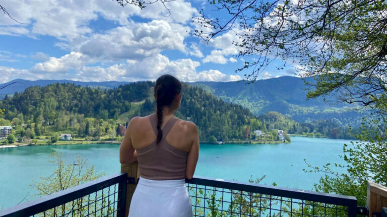 Author Brooke gazing at the lake in Slovenia