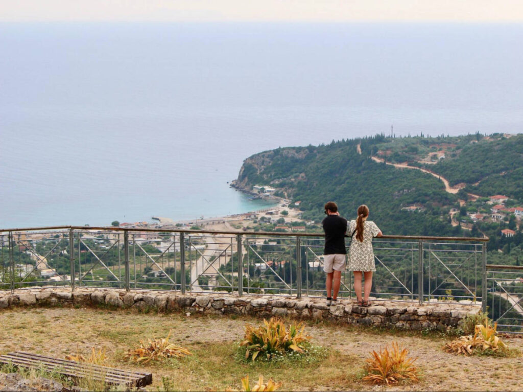 Two people admiring the overlooking view of the  Ionian Sea