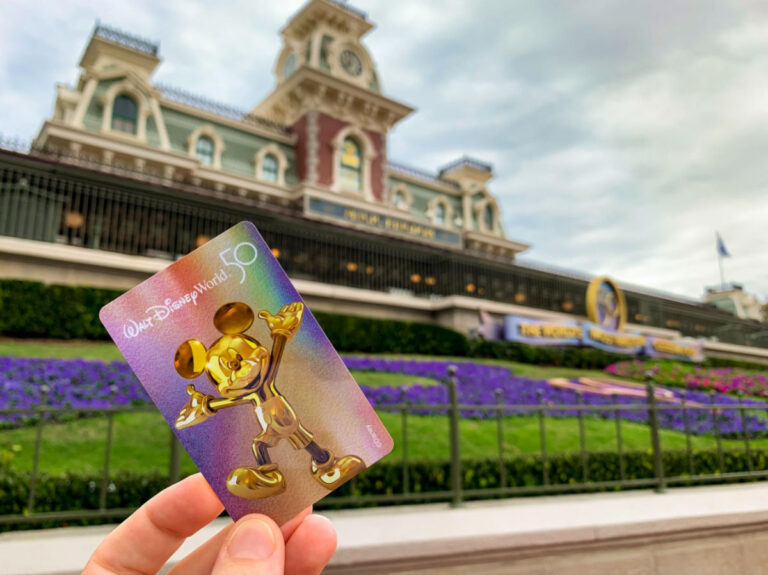 Holding a Disney Park Hopper Card