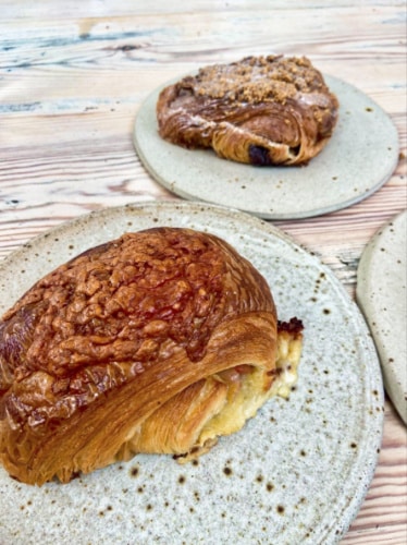 Two plates with different variety of pastries from Pophams
