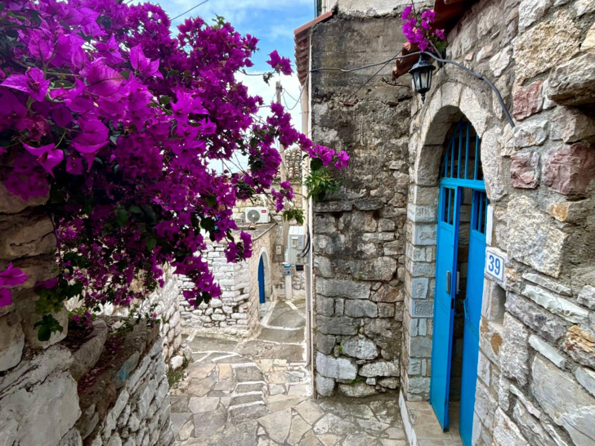 View of the blooming flowers over the pathway in Old Himarë Castle