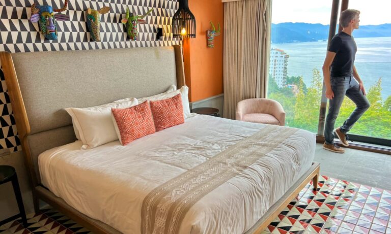 Author Nate Hake at the Patio Azul boutique hotel looking out over the ocean from a guest room