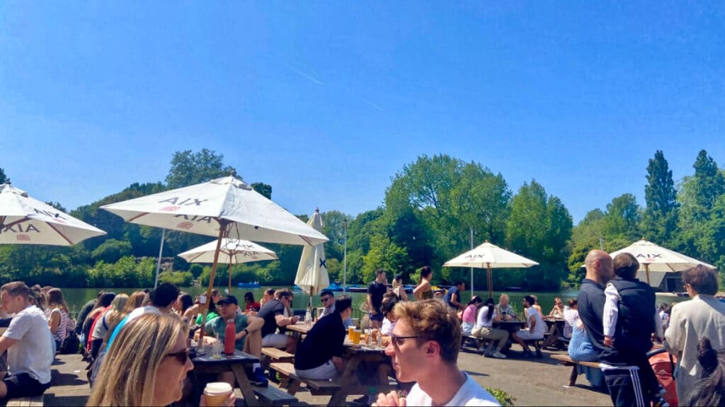 View of the people dining at the picnic tables at the Pear Tree Cafe on a sunny day