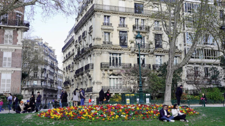 View of people enjoying her day on a neighborhood in Paris