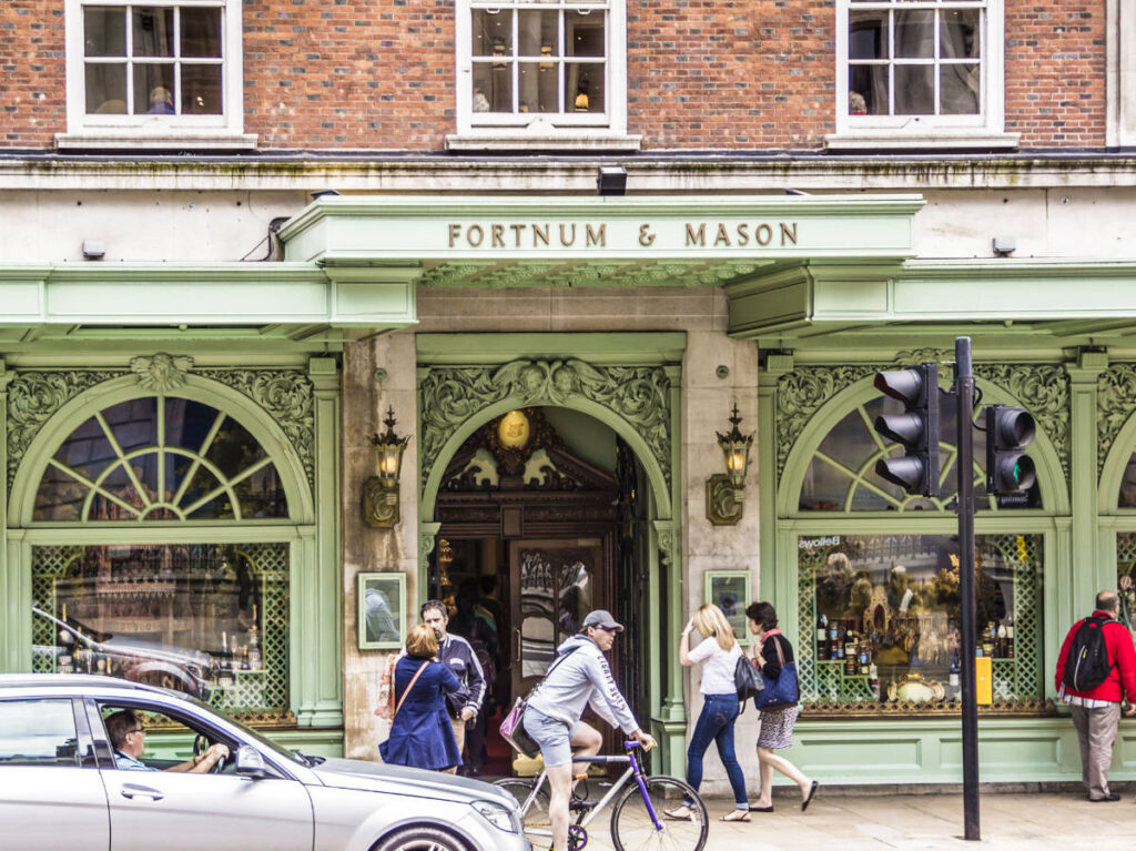 View of the people near the entrance to Fortnum & Mason Diamond Jubilee Tea Salon seen from across the street