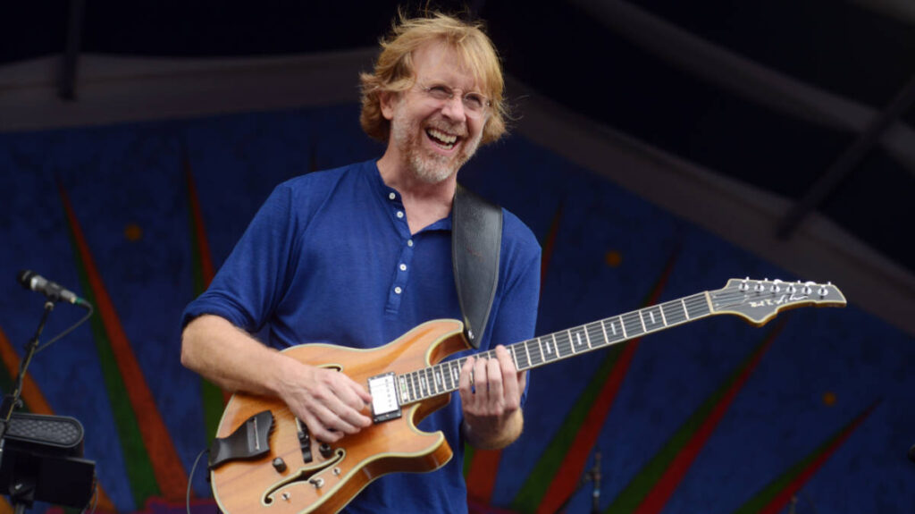 Trey Anastacio, lead singer of Phish smiling while performing