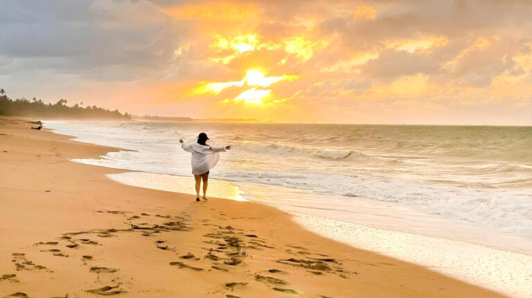 Travel Lemming author Vanessa Ramos at Playa El Caracol in Dorado during sunset