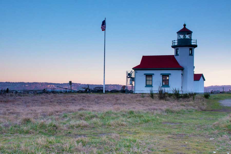 View of the Point Robinson Lighthouse and the colorful sky in Seattle