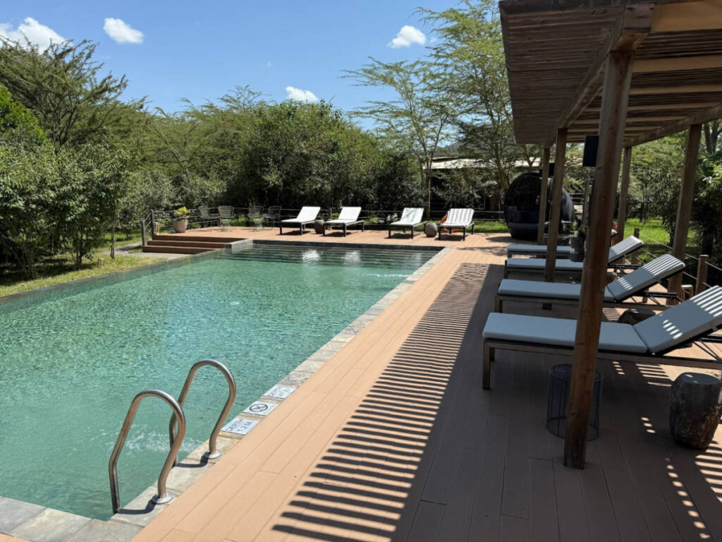 View of the tranquil pool area of JW Masai Mara