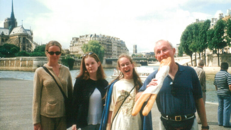 The author Rachel and her family, posing for a photo in front of the Notre Dame