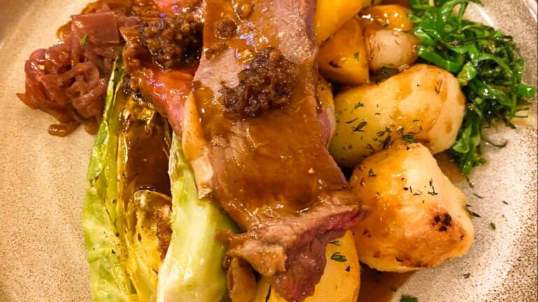Closeup view of the London foods, roast beef with vegetables on a plate