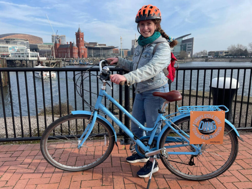 The author Ruthie Walters holding the bicycle from Ding in Cardiff