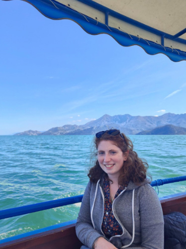 Ruthie Walters smiling for a photo during a boat tour on Lake Virpazar, Montenegro