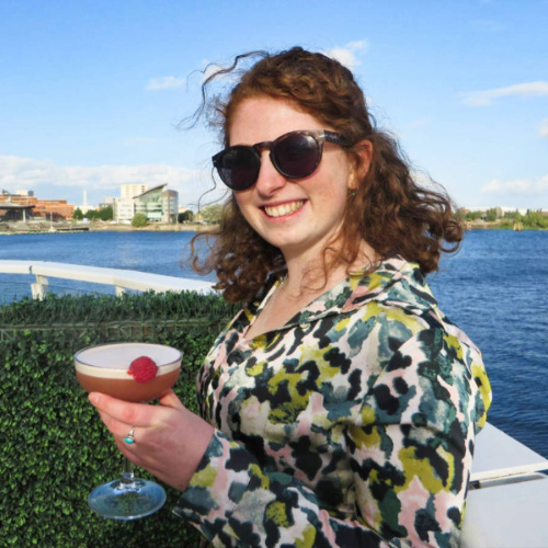 Ruthie Walters holding a glass of cocktail