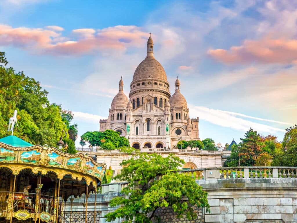 View of a carousel and the Sacré Coeur Cathedral from a distance