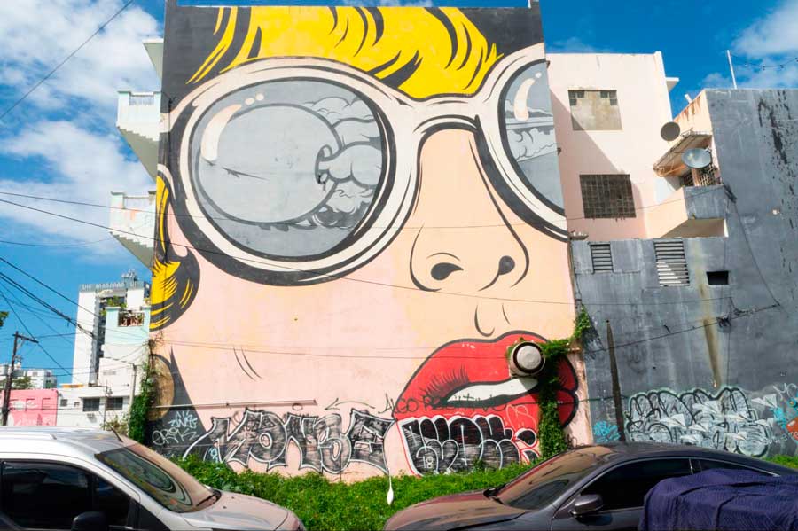 A colorful wall mural on the street in San Juan